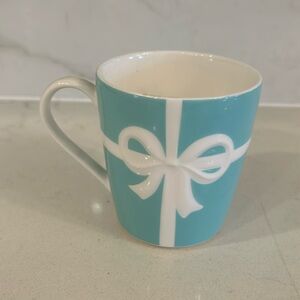 Tiffany & Co BOW MUG 
Retired and no longer made. RARE. 
Original design